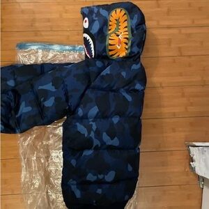 Blue Camouflage Puffer Jacket with Graphic Hood